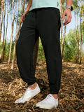 Campus Sutra Solid Belted Trousers