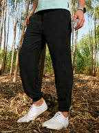 Campus Sutra Solid Belted Trousers
