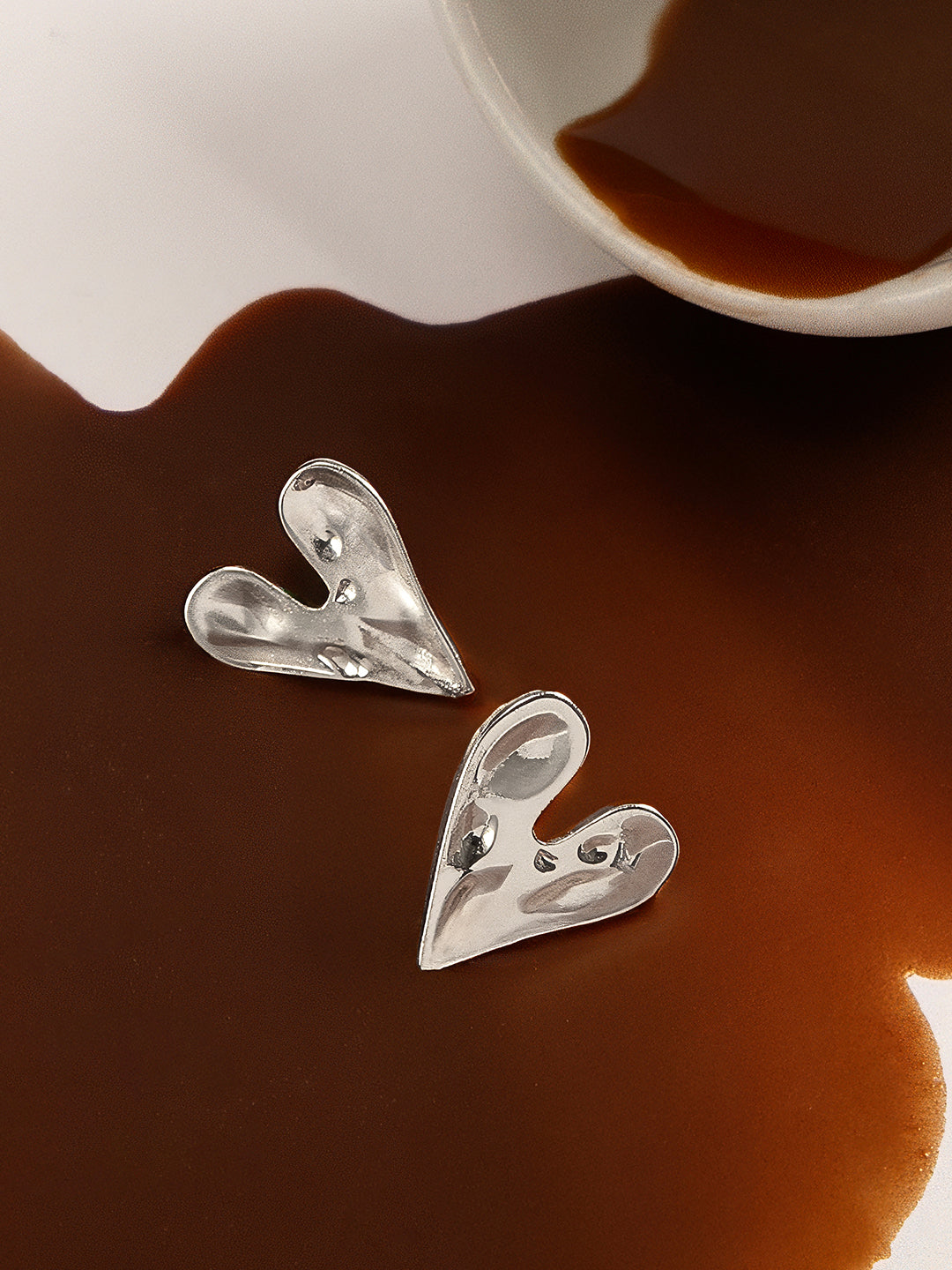 The Dented-Coeur Stud Earrings - Metallic Silver