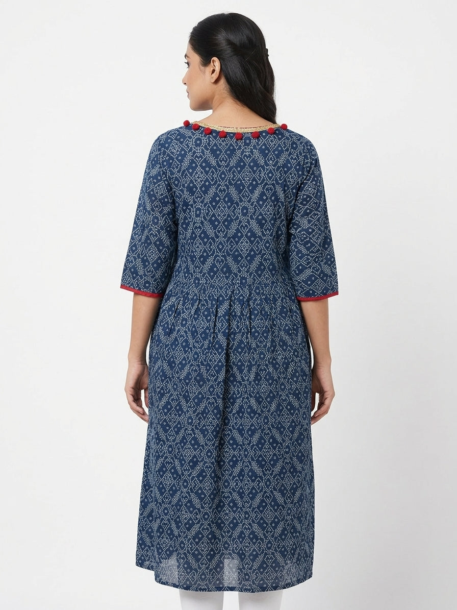 Blue Bandhani Style Kurti with Gold Trim and Red Embellishments
